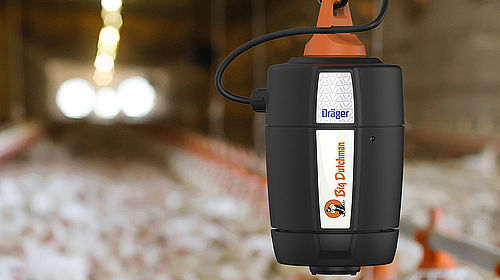 a sensor hangs in a chicken shed