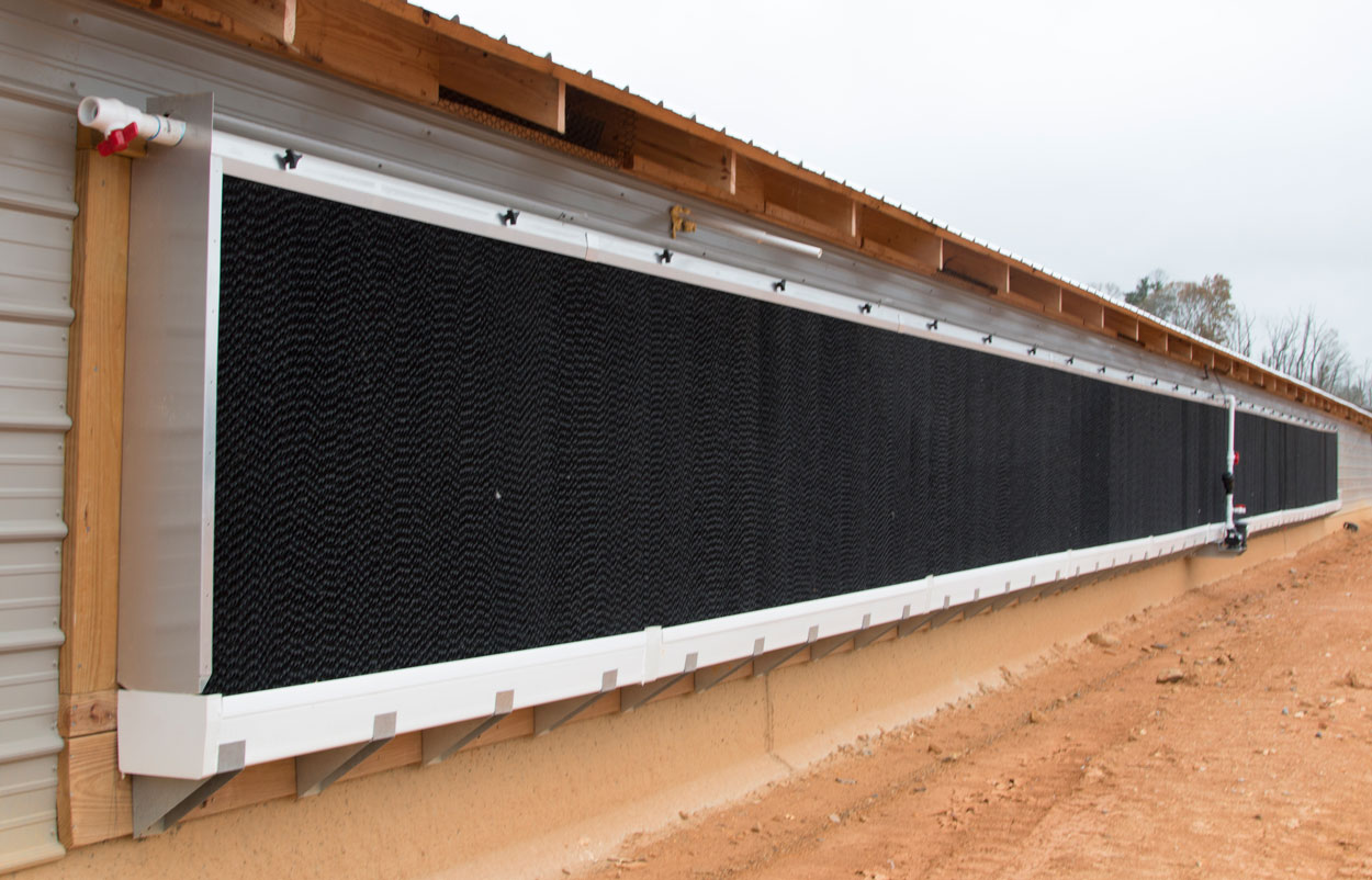 Hog Slat EVAP evaporative cool cell systems are designed with features and improvements that increase performance and reliability for your poultry and swine cooling needs. Our double leg bracket design provides superior support for EVAP systems when attached directly to a barn.